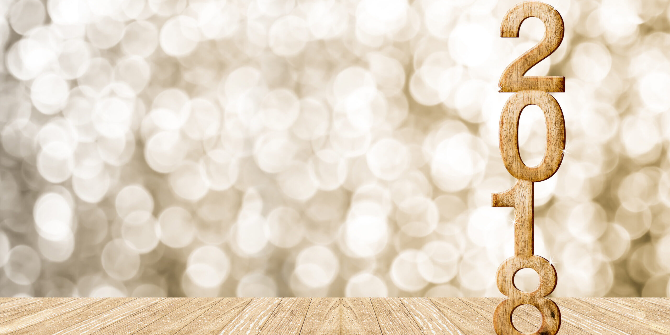 2016 year wood number in perspective room with sparkling bokeh wall and wooden plank floor