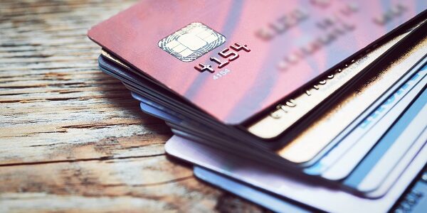 Set of color credit cards on wooden table