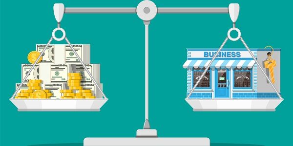 Scales with commercial property with key and money