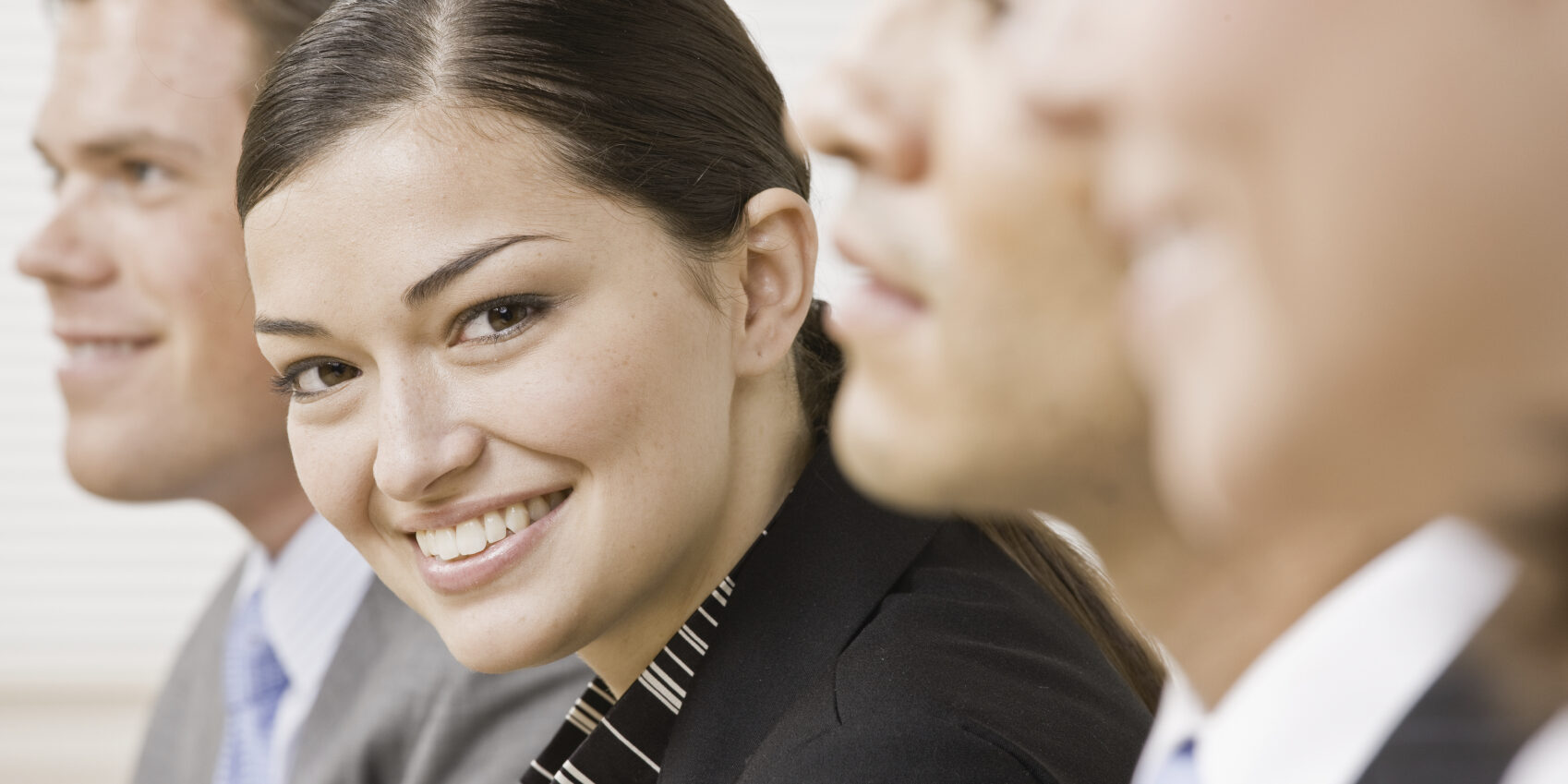 Businesswoman posing with colleagues