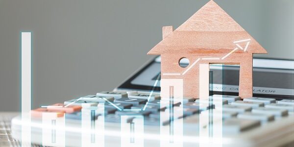 House Miniature model on calculator with over digital chart repo